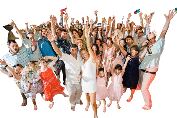 group of family and friends celebrating with arms raised in the air