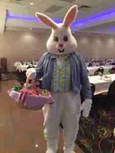 Easter Bunny holding a basket of treats