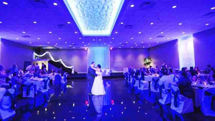 Balconade Room dance floor at wedding reception with blue custom lighting