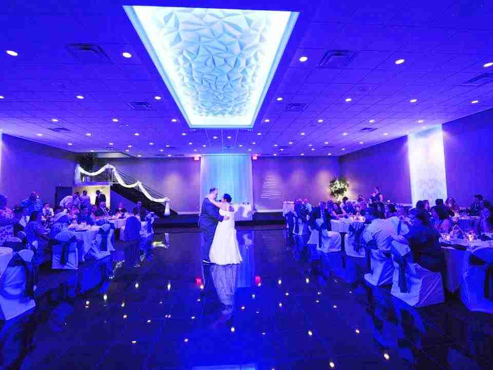 Balconade Room dance floor at wedding reception with blue custom lighting