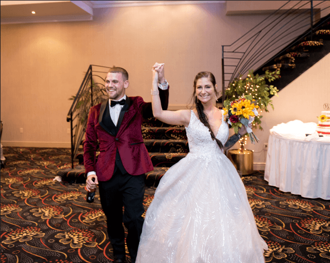 bride and groom descend the bridal staircase in the Grand Ballroom