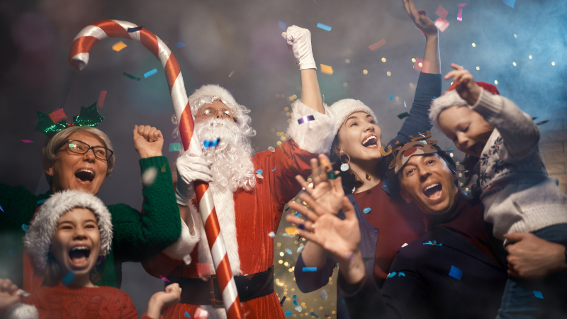 Santa holding candy cane celebrating with guests