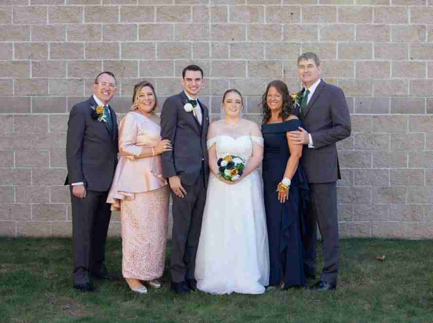 Bride and Groom with their parents on their wedding day