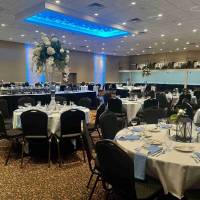 deep blue room lighting with tall floral bouquets