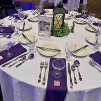 Royal purple tabletop decor for milestone celebration