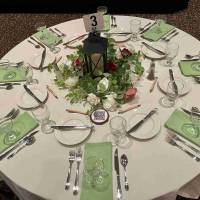 Pastel green tabletop decor with greenery