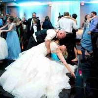 reception-dancing-bride-groom groom dips bride while dancing in the Balconade Room