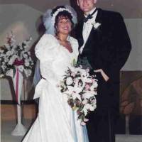 Bride and groom pose for photos following their wedding ceremony in October 1995